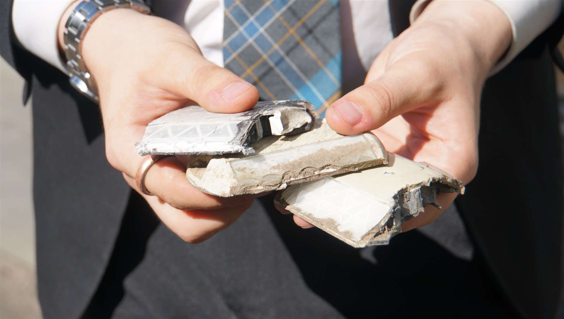 Dylan shows how the road studs have been broken. He claims they did not last long after being initially put in. He witnessed one stud come flying off five feet in the air after being hit by a truck.