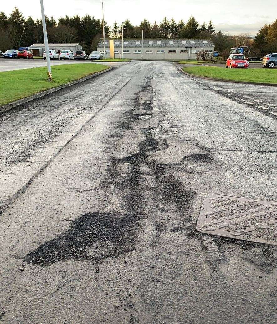 A damaged section of road near the Wick driving test centre.