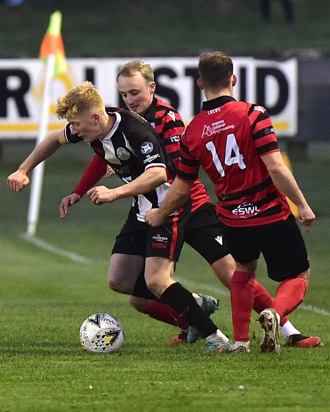 Ross Gunn finds a gap between Inverurie's Jamie Michie and Liam Morrison. Picture: Mel Roger