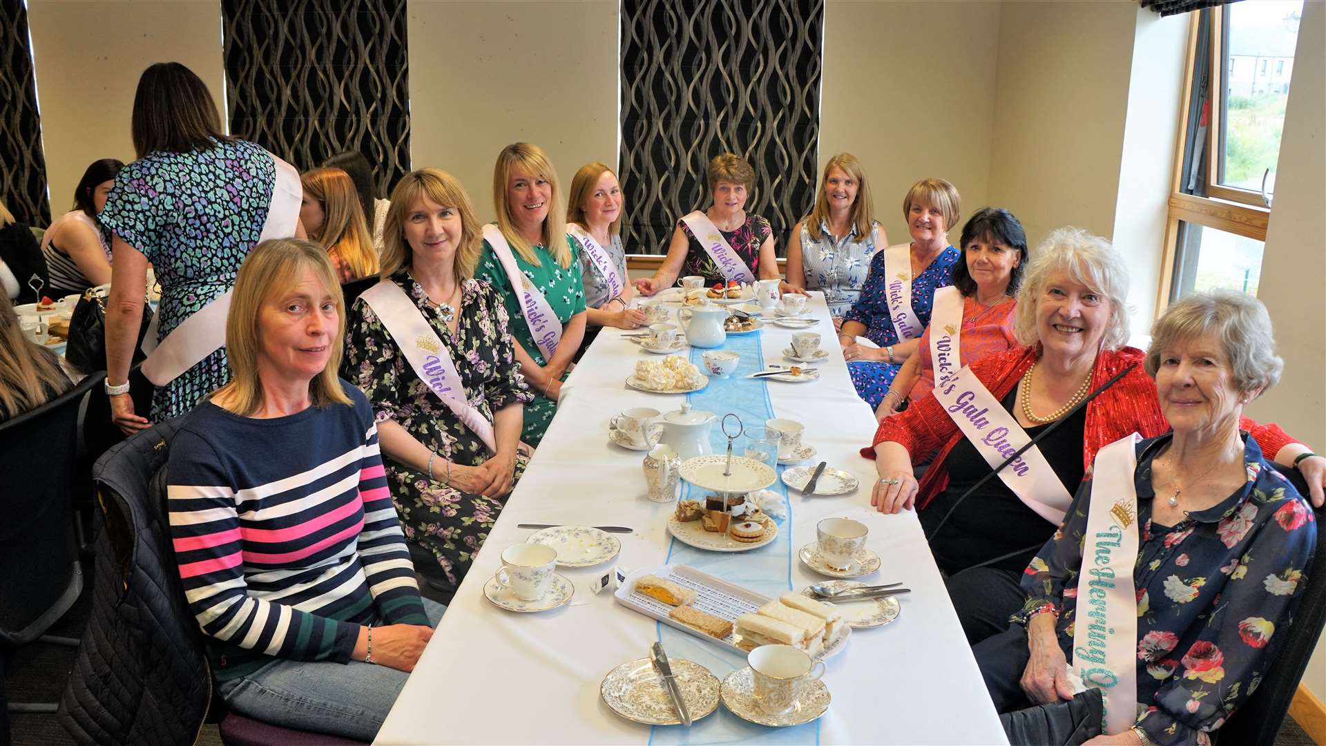 Some of the gala queens and attendants have lunch at the Pulteney Centre. Pictured at rear right is Jennifer Harvey from PPP who set up the special one-day show. Nearest the camera at right are Nancy Nicolson and Ray Richard. Picture: DGS