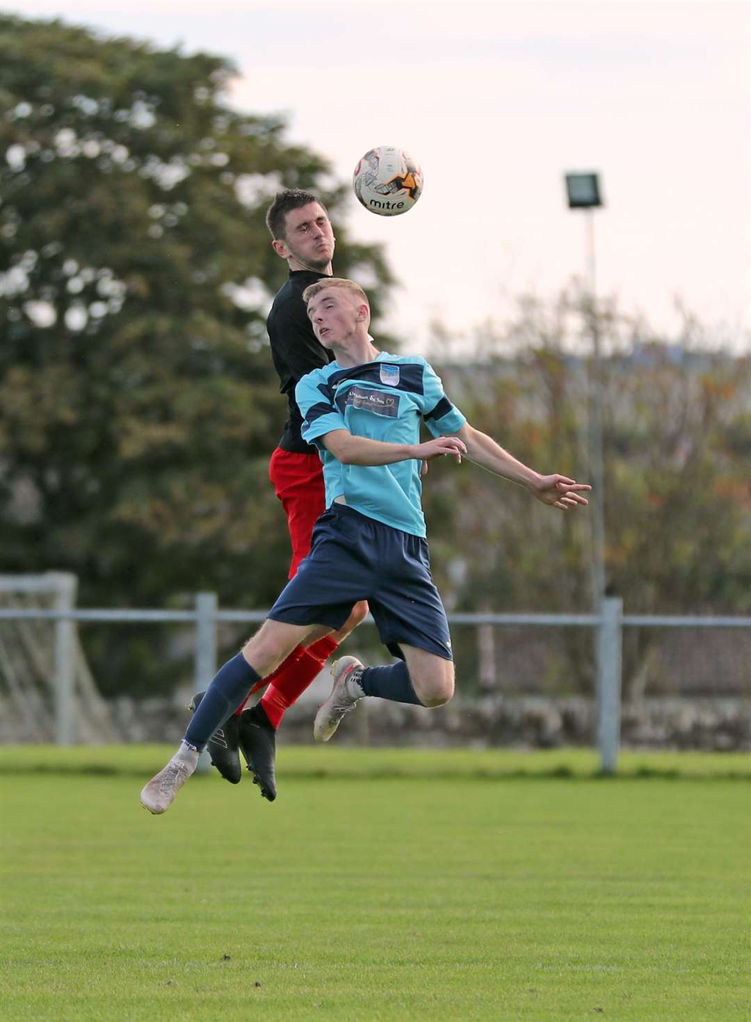 Bryan Reid in an aerial duel with Euan Henderson during Halkirk United's 4-2 defeat to Alness United at Morrison Park at the end of September. Picture: James Gunn