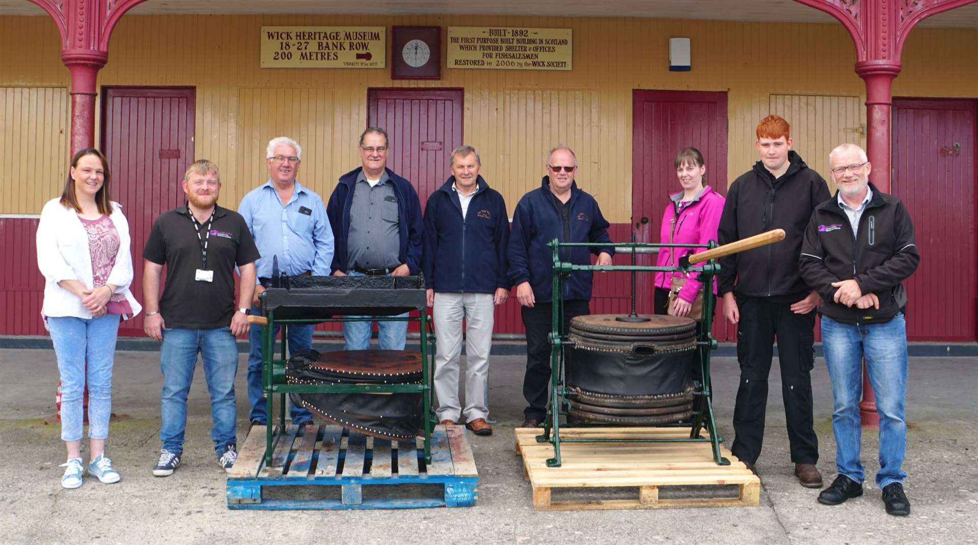 Members of the Wick Society together with some of the college team who restored the bellows.