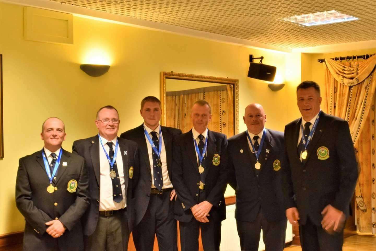 The Scotland squad pictured with their silver medals.