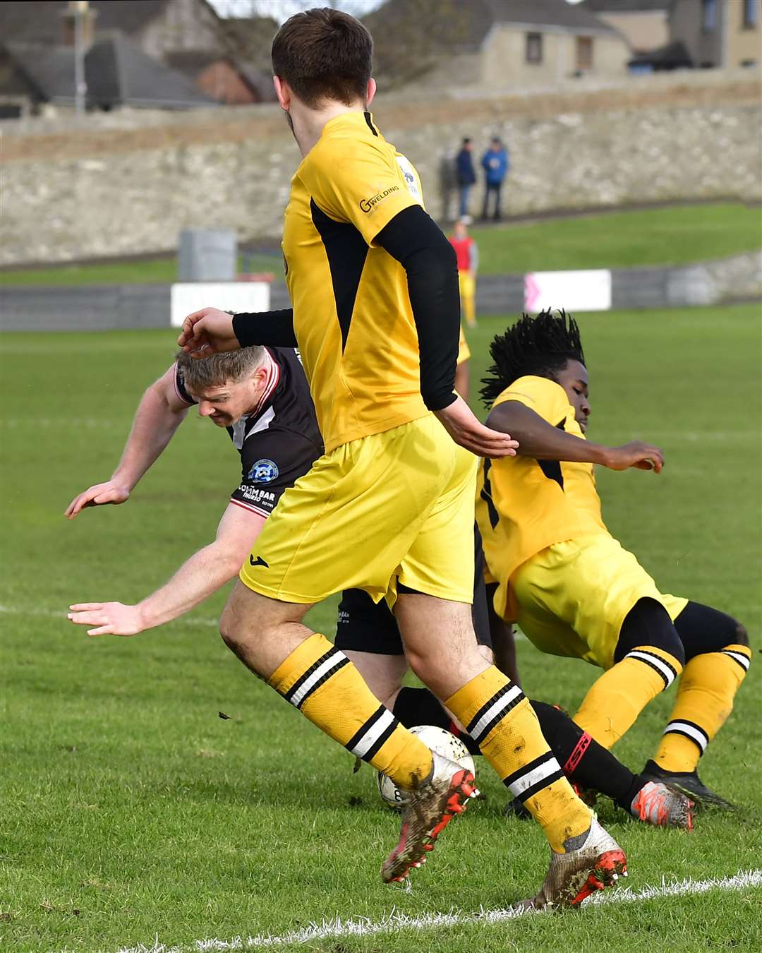 Davie Allan is tripped by Diakite Diallo of Fort William for the penalty that led to Wick Academy's opening goal against Fort William on Saturday. Picture: Mel Roger
