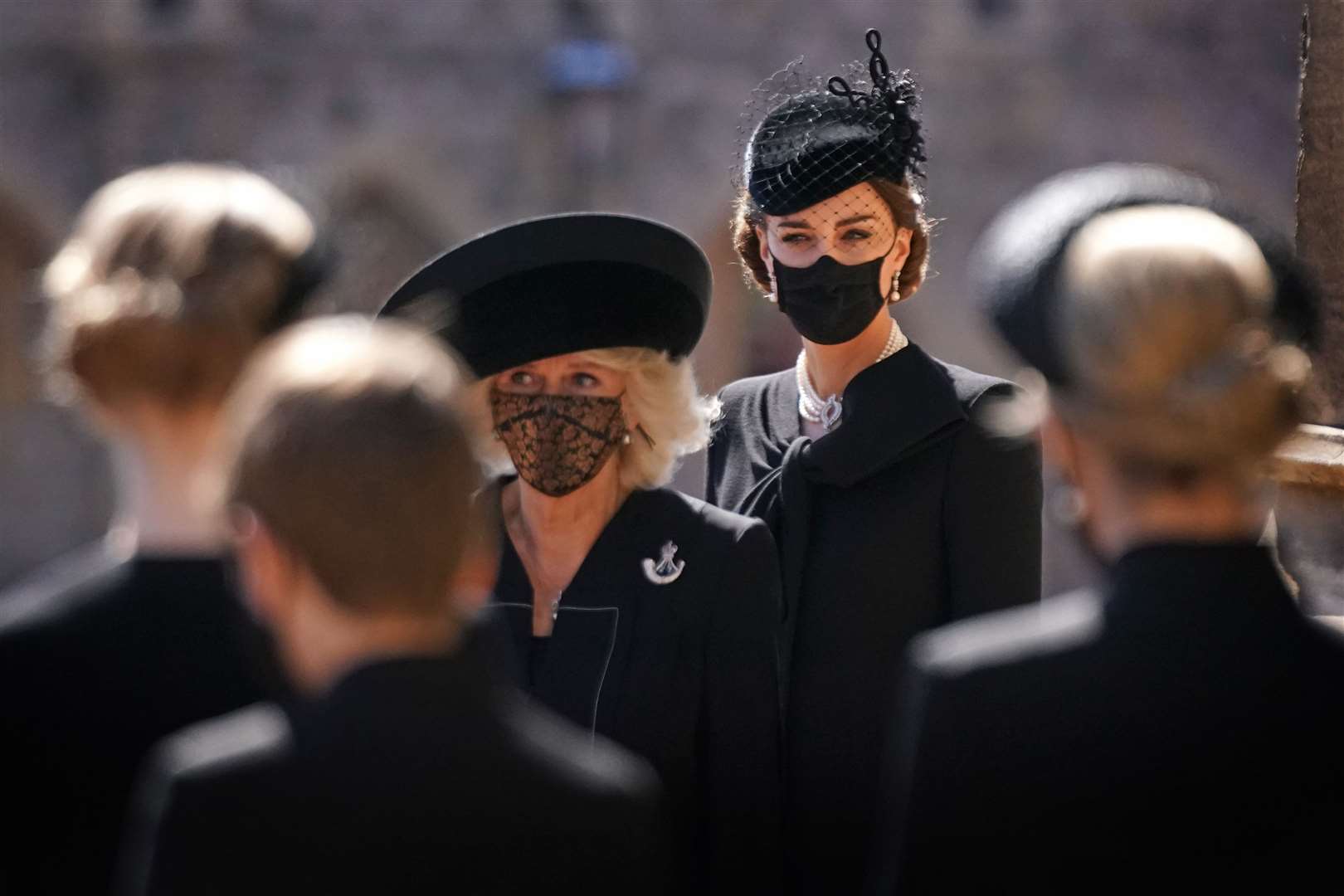 The Duchess of Cornwall and the Duchess of Cambridge in their face coverings (Victoria Jones/PA)