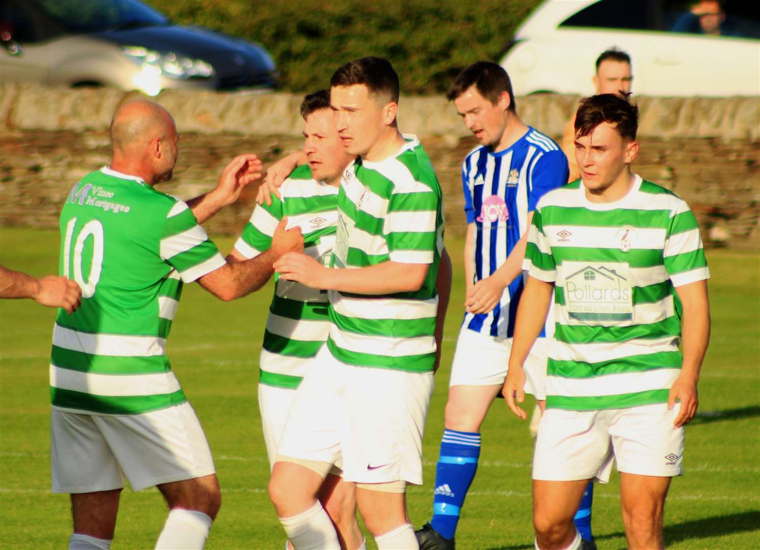 Castletown players celebrate after Michael Smith's first-half strike against Lybster in the David Allan Shield semi-final at Back Park on Wednesday night. It proved to be the only goal of the game.