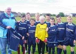 May Shearsmith and the Halkirk Primary 'A' team with their new strips.