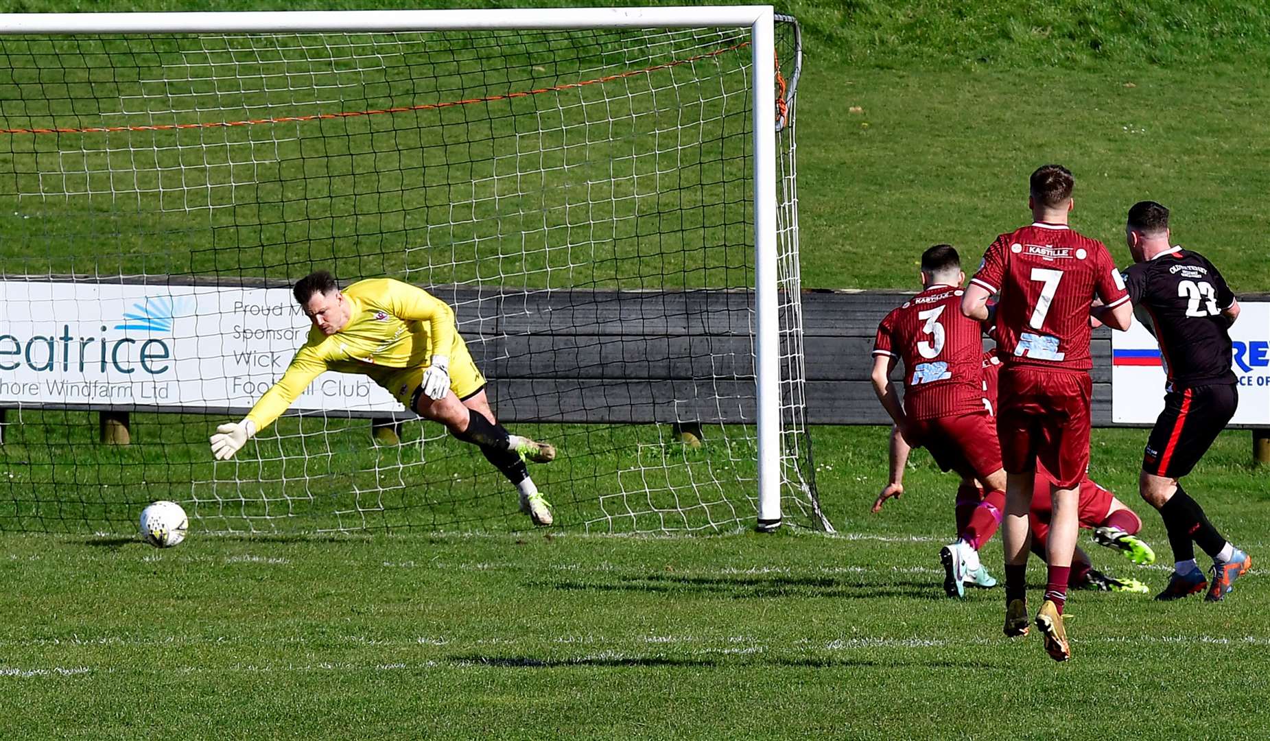 Gordon MacNab slams the ball past Keith keeper Craig Reid to open the scoring for Wick Academy. Picture: Mel Roger