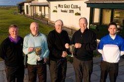Ron Taylor (centre right), Wick’s scratch champion, receives his trophy from vice-captain Rob Sutherland. Handicap champion was Robert Klimas. Runner-up in the handicap championship was Michael McAllan (left) and, in the scratch championship, Gordie Steve
