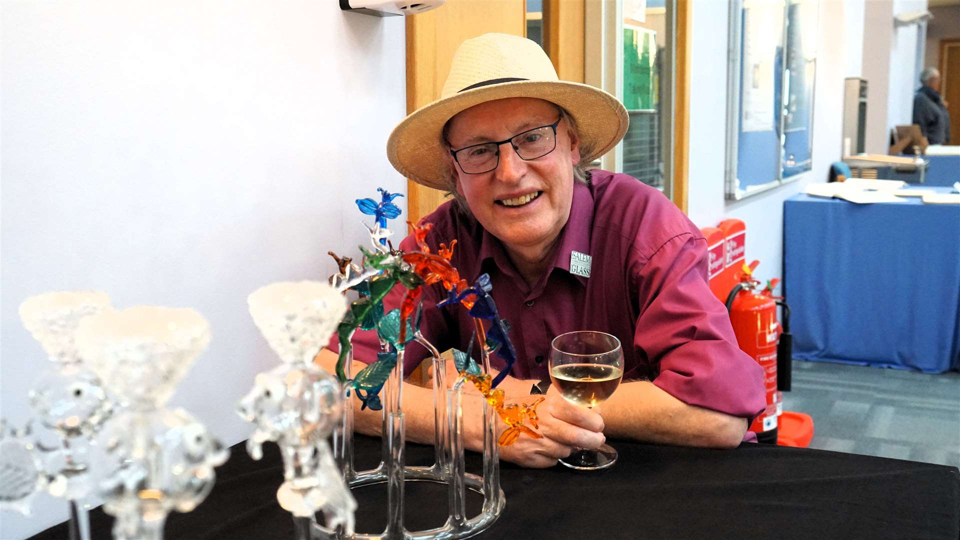 Chair of the art show Ian Pearson beside his enigmatic glass creations. Picture: DGS