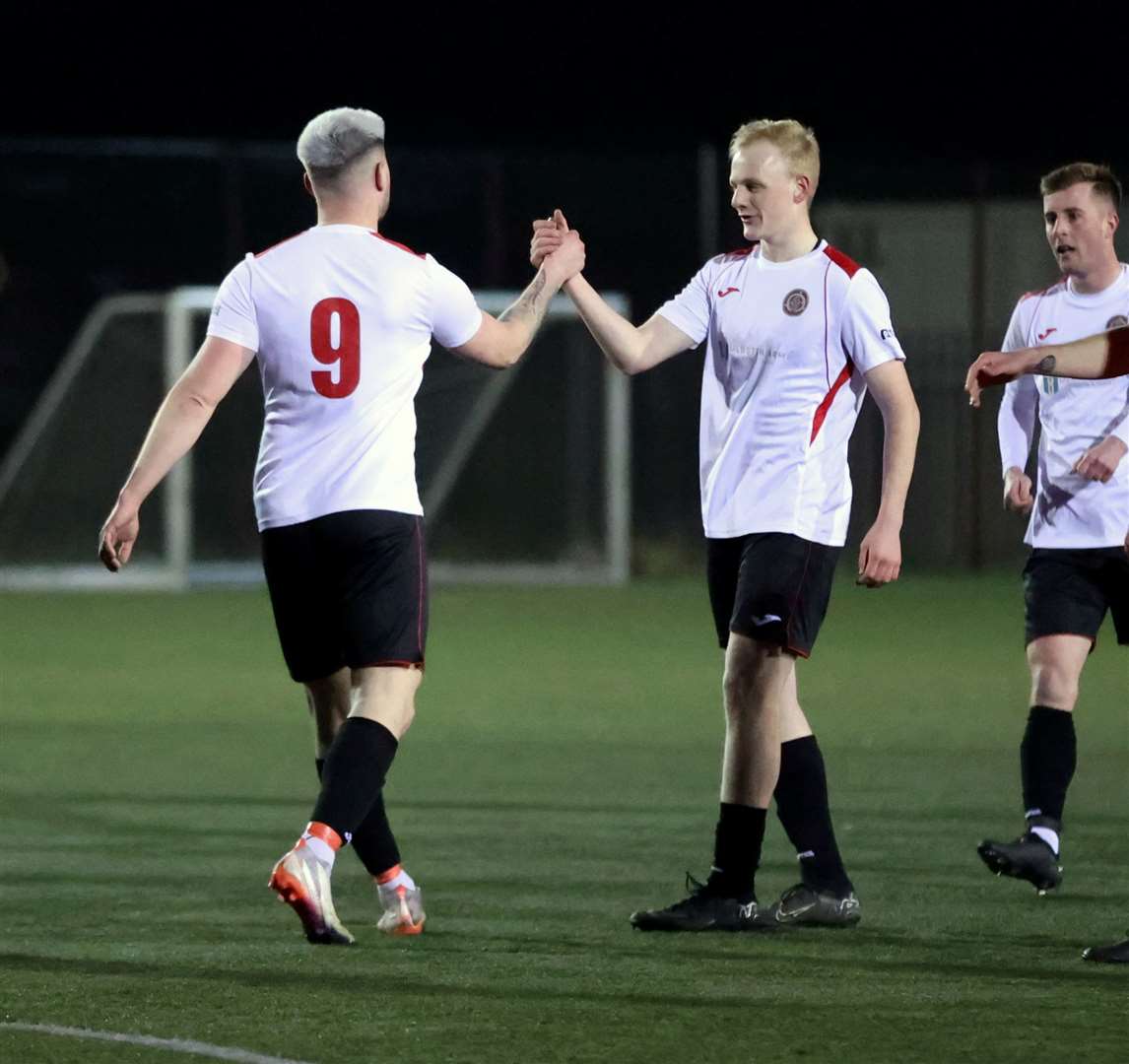 Halkirk United's Kuba Koziol is congratulated by Ethan Kevill after the opening goal. Picture: James Gunn