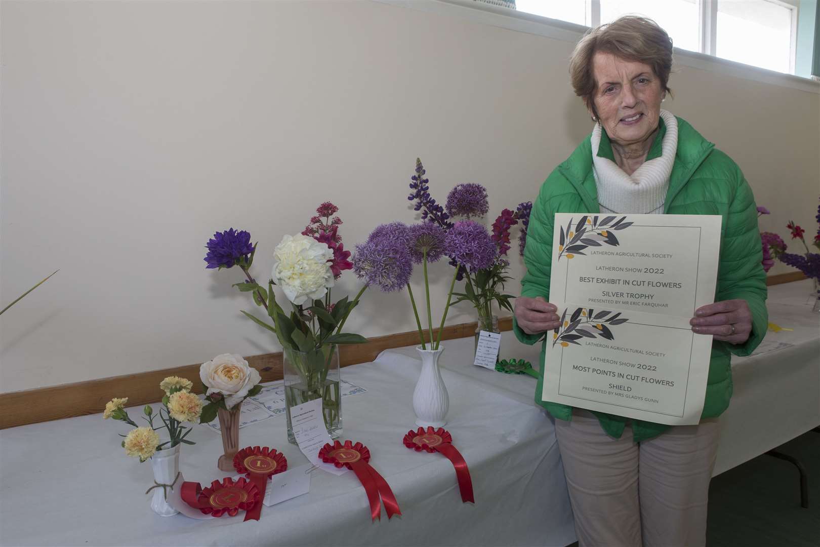Gladys Gunn, Latheron, with some of her entries that won her the trophies for most points and best exhibit in cut flowers. Picture: Robert MacDonald/Northern Studios
