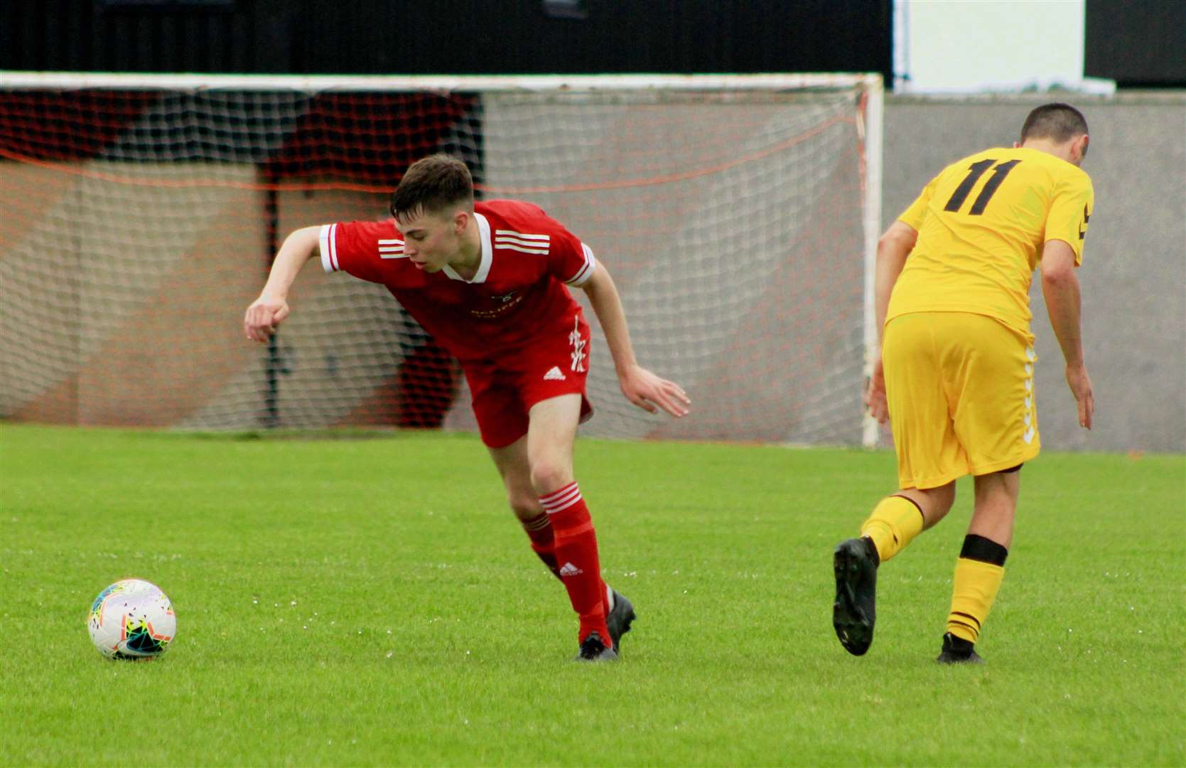 Conor Farquhar races forward for Wick Groats during their victory over Staxigoe United in midweek.