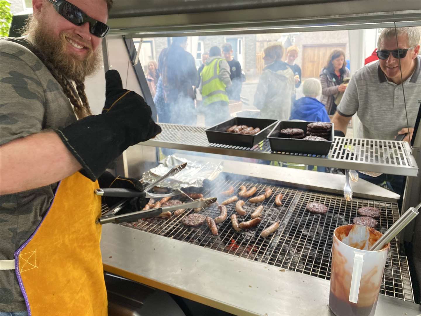 Volunteers helped make the barbecue a sizzling success.