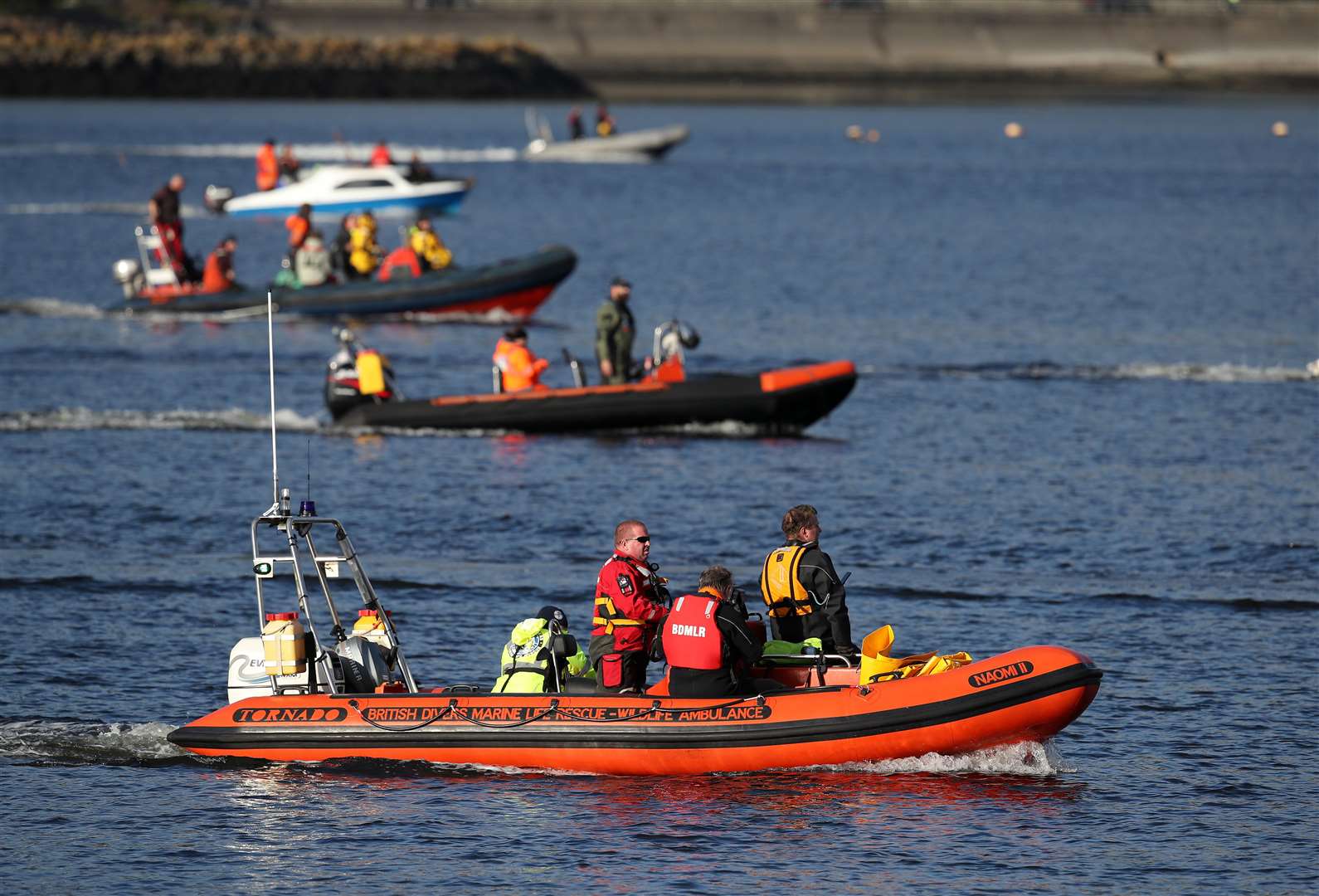 Rescuers attempted to shepherd the whales back out to sea (Andrew Milligan/PA)