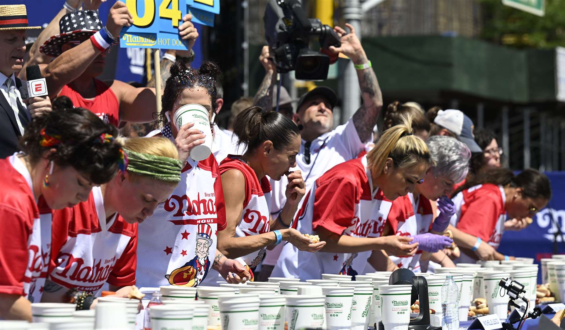 Female contestants participate in the competition in Coney Island (Major League Eating/PA)