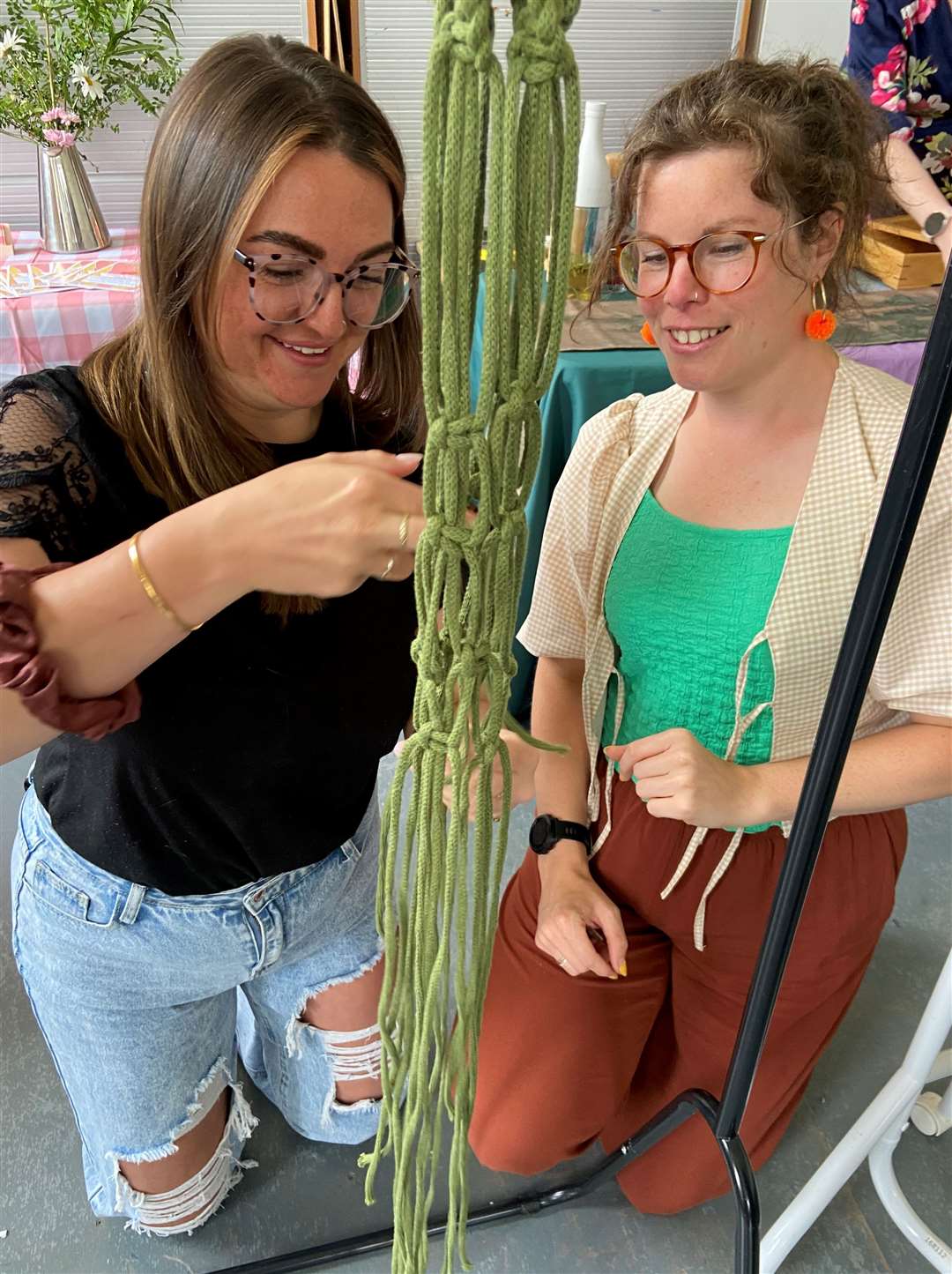 Rosie Wade, left, is shown the ropes by 'Annie and the Hooks'. Picture: Suz Elvey