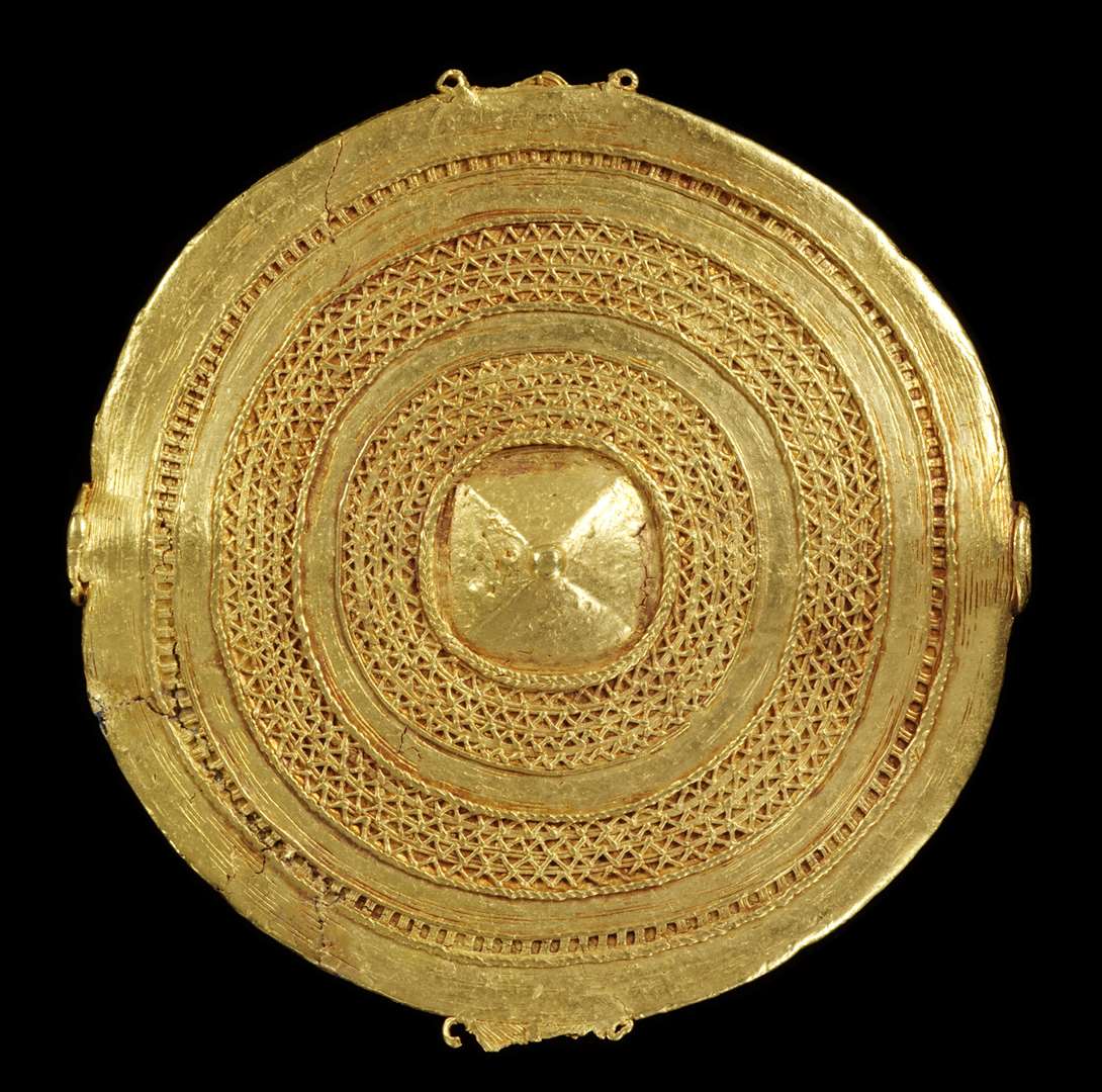 A cast gold badge which was among the selection of Asante gold taken from Ghana (Victoria and Albert Museum/PA)
