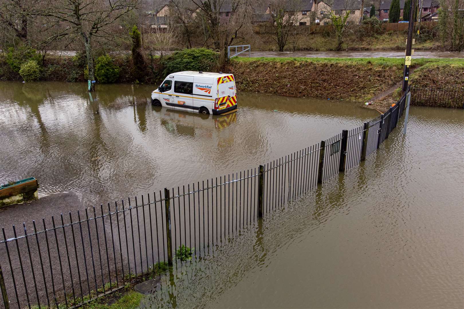A van parked in water next to the River Taff in Taffs Well, Wales, this week (Ben Birchall/PA)