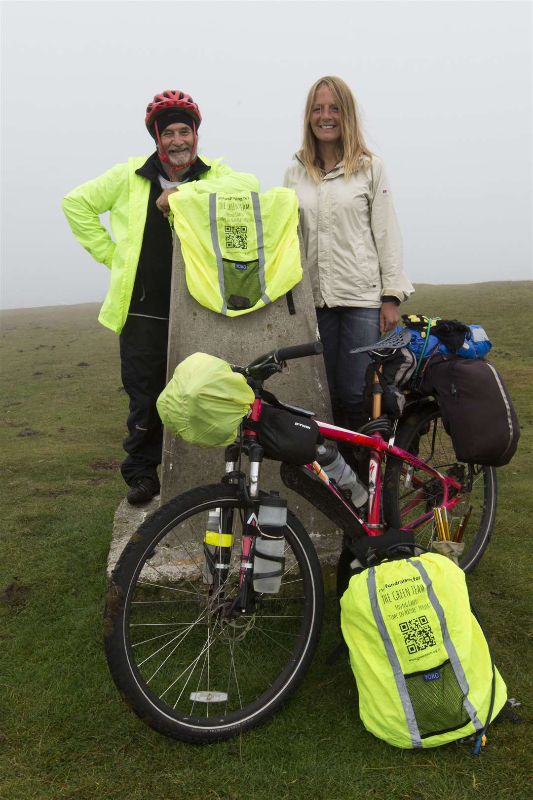 Peter Wright with Lorna Stanger at the trig point at Duncansby Head. Picture: Robert MacDonald/Northern Studios