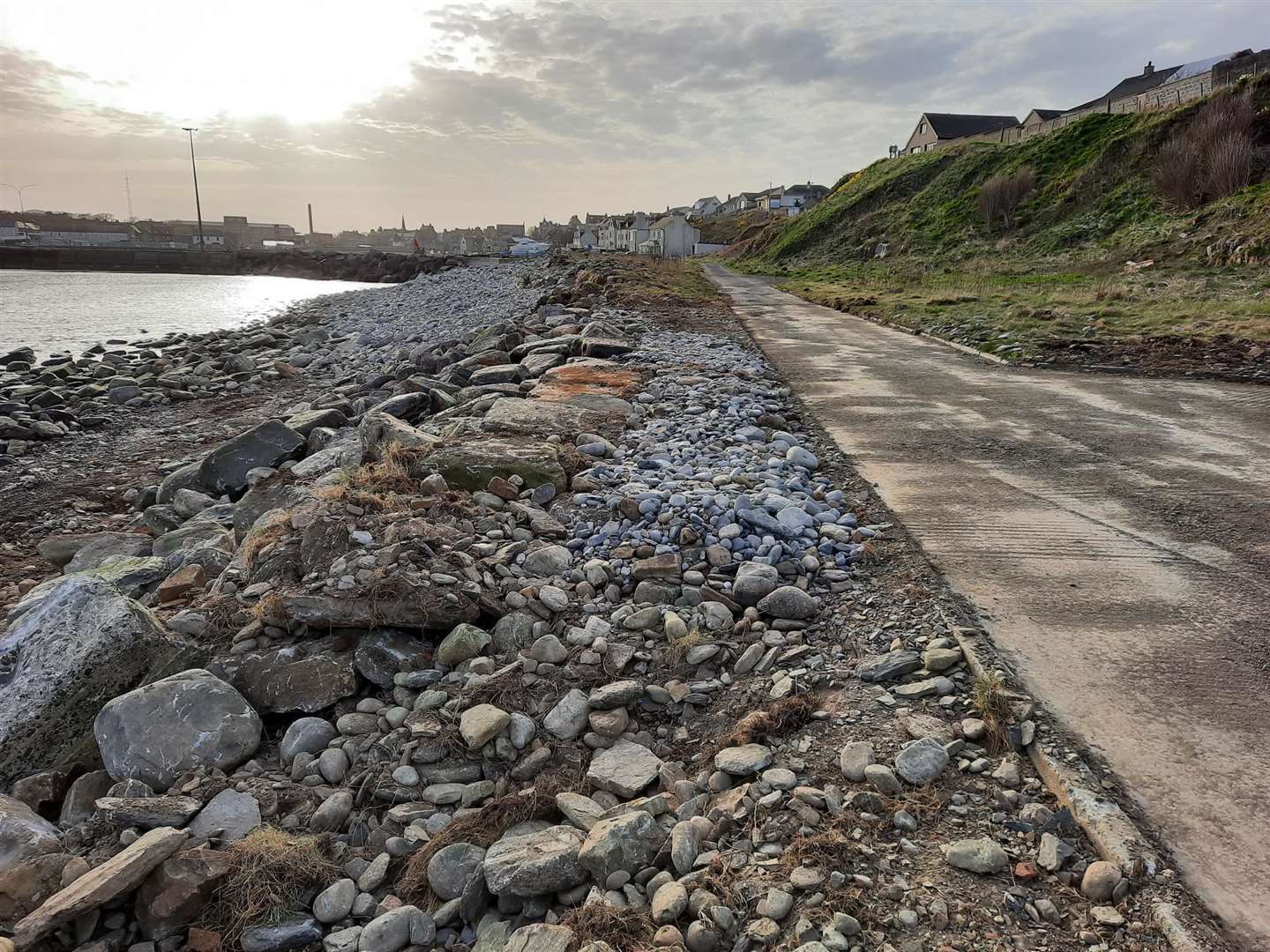 The access road beside Wick Bay has suffered from coastal erosion over the years, particularly when easterly gales have generated large waves. Large boulders were pulled up from the shore and strategically placed to prevent further damage. Picture: Wick Paths Group