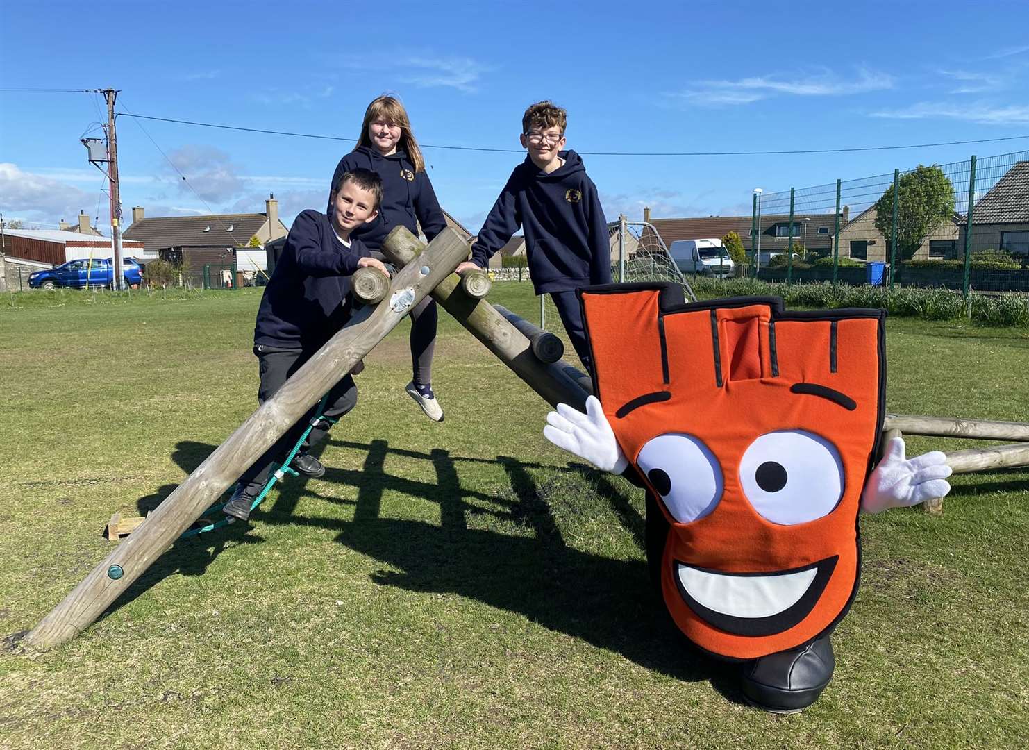 P5 pupils showing Strider some of their play equipment.