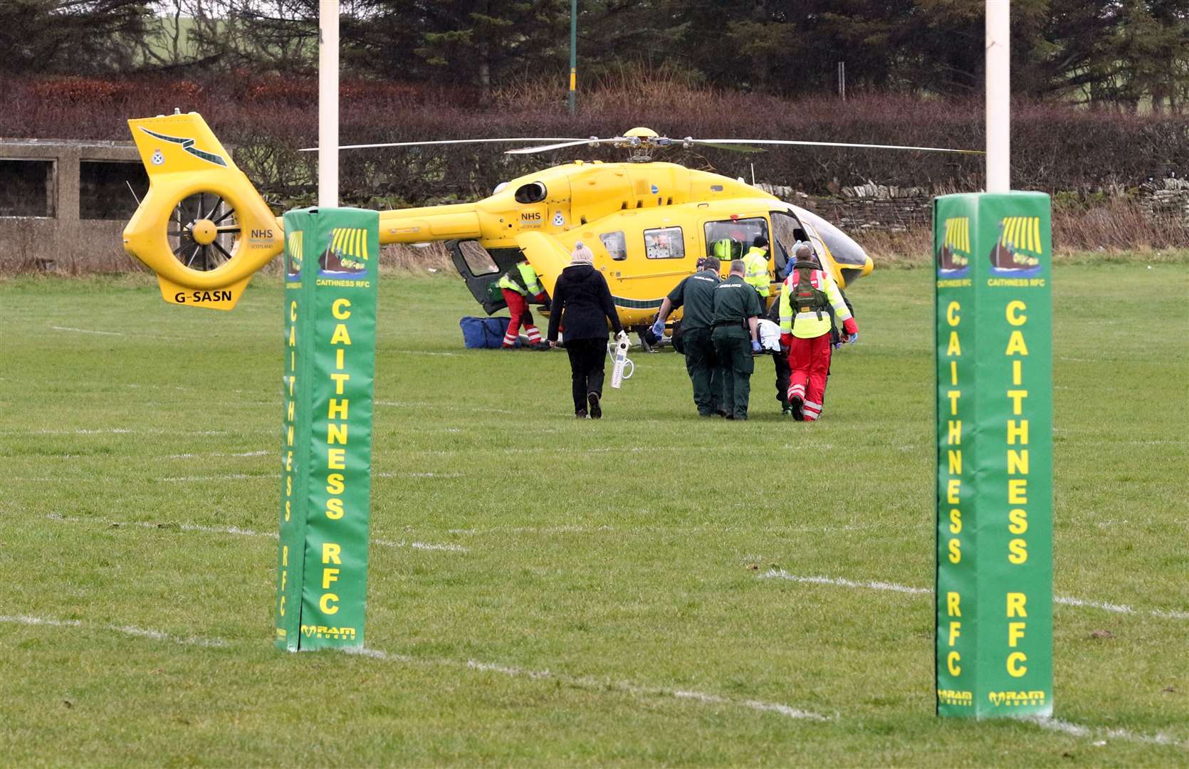Callum Hill is stretchered into the air ambulance at Millbank. Picture: James Gunn