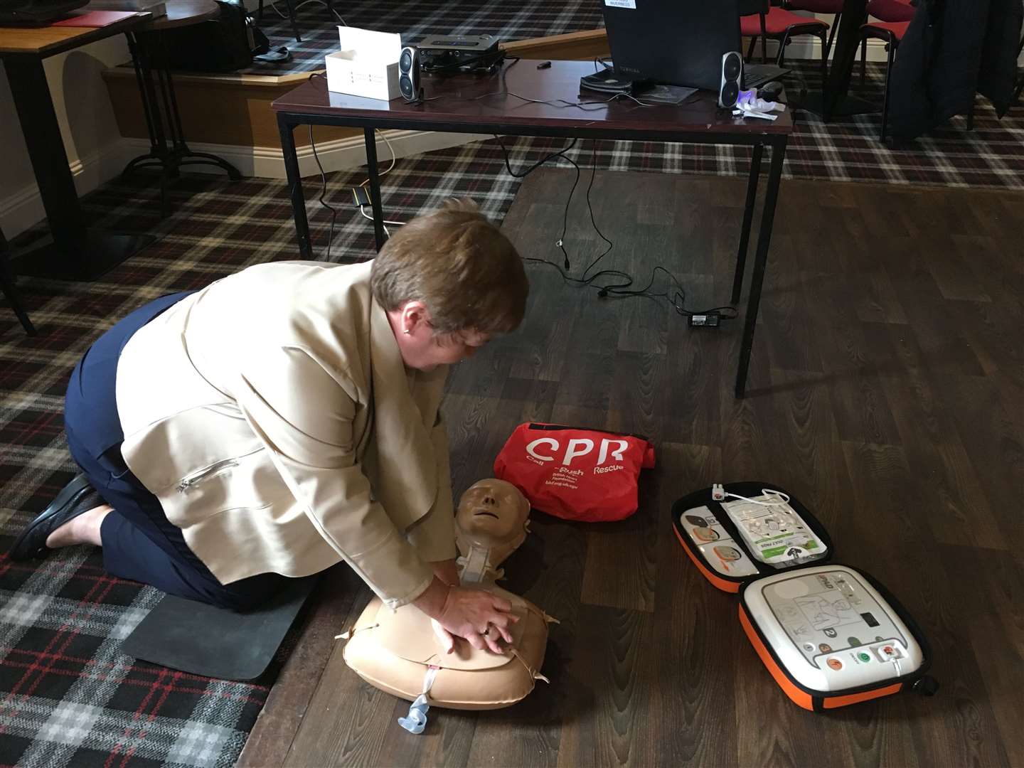 Rhoda Grant undergoing CPR training in Inverness.