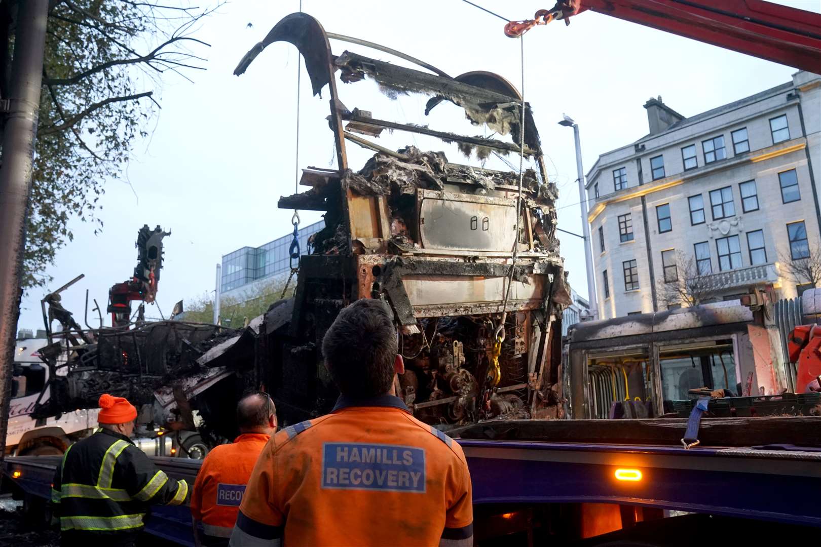 A bus is removed from O’Connell Street in Dublin (Brian Lawless/PA)