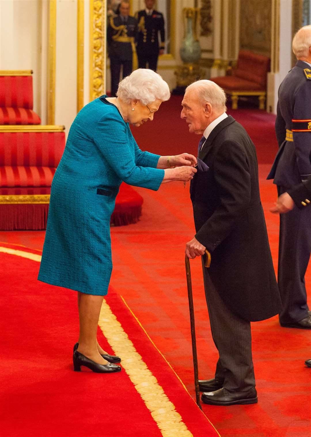 Squadron Leader George Leonard ‘Johnny’ Johnson was made an MBE by the Queen (Dominic Lipinski/PA)