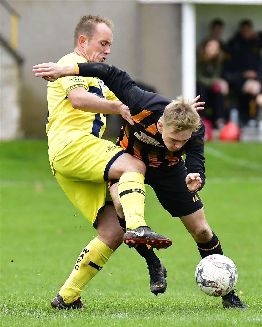 Richard Macadie tangles with Huntly's Nathan Meres at Christie Park on Saturday. Picture: Mel Roger