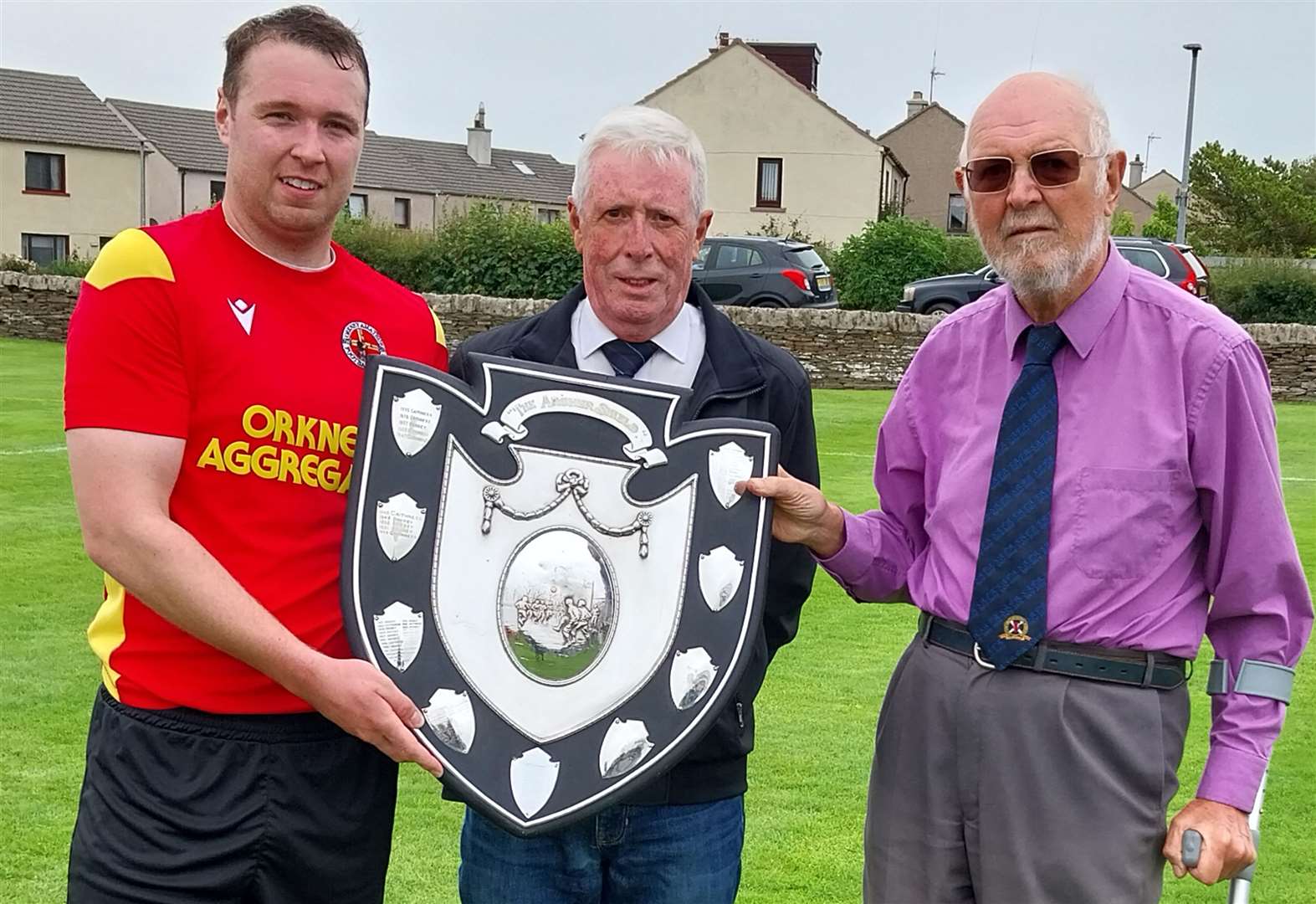 Orkney Captain Wayne Kirkness, Murray Coghill CAFA Chairman and Mr Ken Wood former Caithness AFA & Highland Amateur Cup Executive Committee Secretary. Picture: Angus Mackay