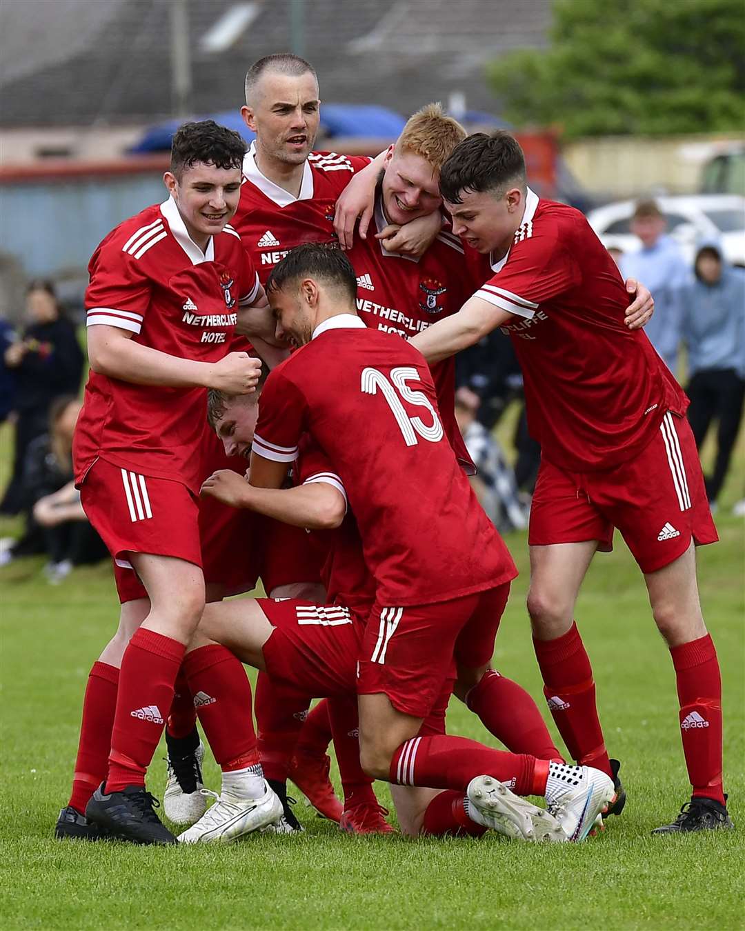 Korbyn Cameron is mobbed by team-mates after putting Wick Groats 2-1 up in extra time. Picture: Mel Roger