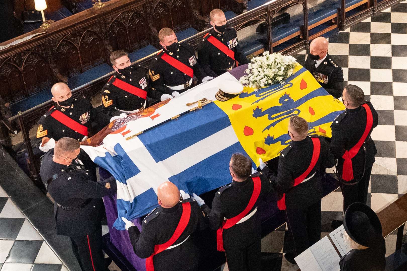 Pallbearers place the the duke’s coffin on the catafalque during his funeral at St George’s Chapel (Dominic Lipinski/PA)
