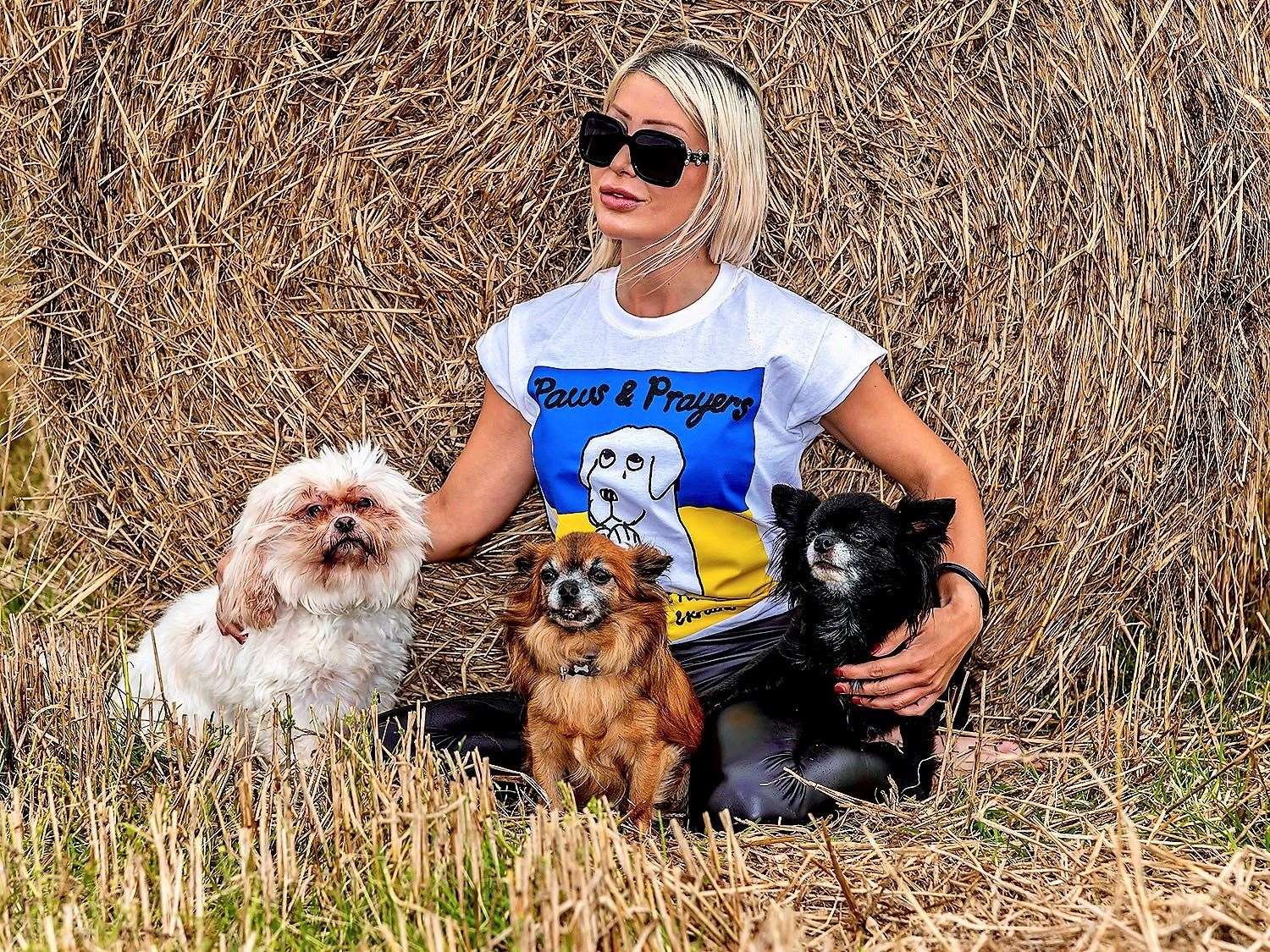Natalie Oag has been undertaking charity walks to raise money to help Ukrainian refugees fleeing with their dogs and also those left behind in the conflict. Natalie is wearing a Paws & Prayers charity T-shirt. Picture: Richard Griffith