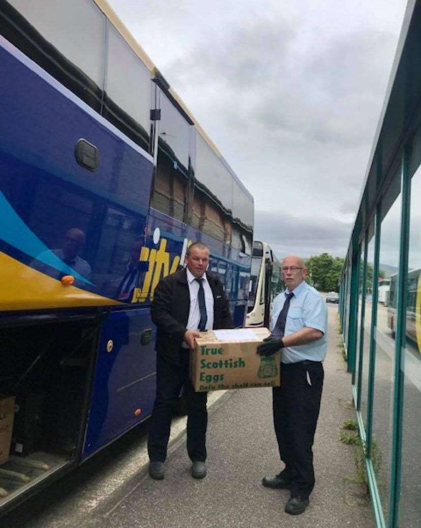 Joe Cormack from West Coast Motors hands over to Shiel Buses driver Dennis Fomicous at Fort William for the journey to Inverness.