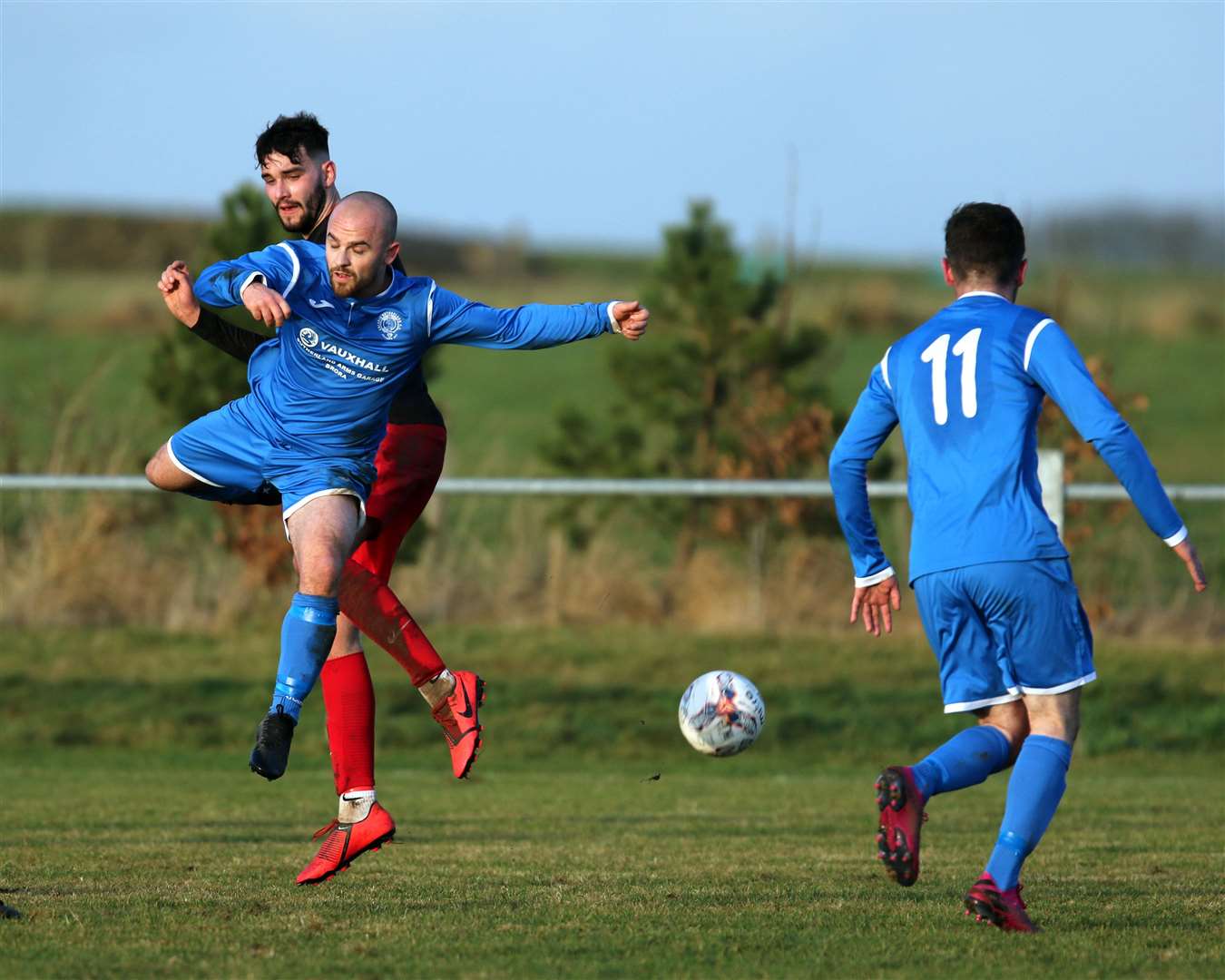 Ryan Sutherland clashes with Martin Banks during Halkirk United's recent 4-0 Football Times Cup defeat to Golspie Sutherland at Morrison Park. Picture: James Gunn