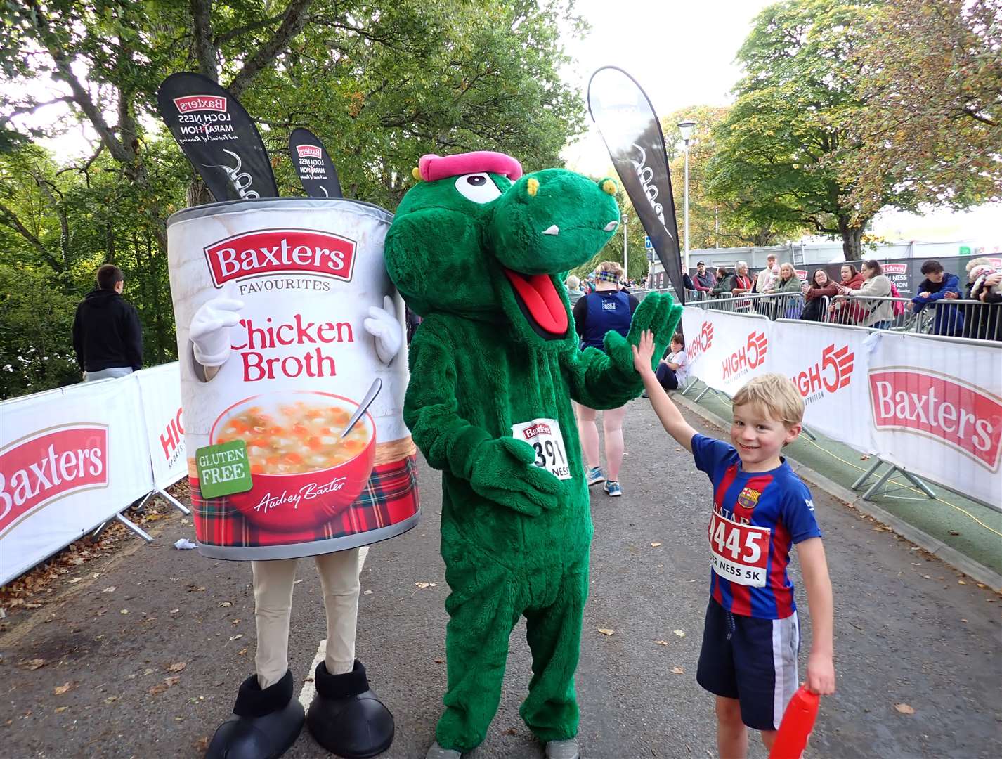 High fives for Nessie after Matthew crosses the finish line.