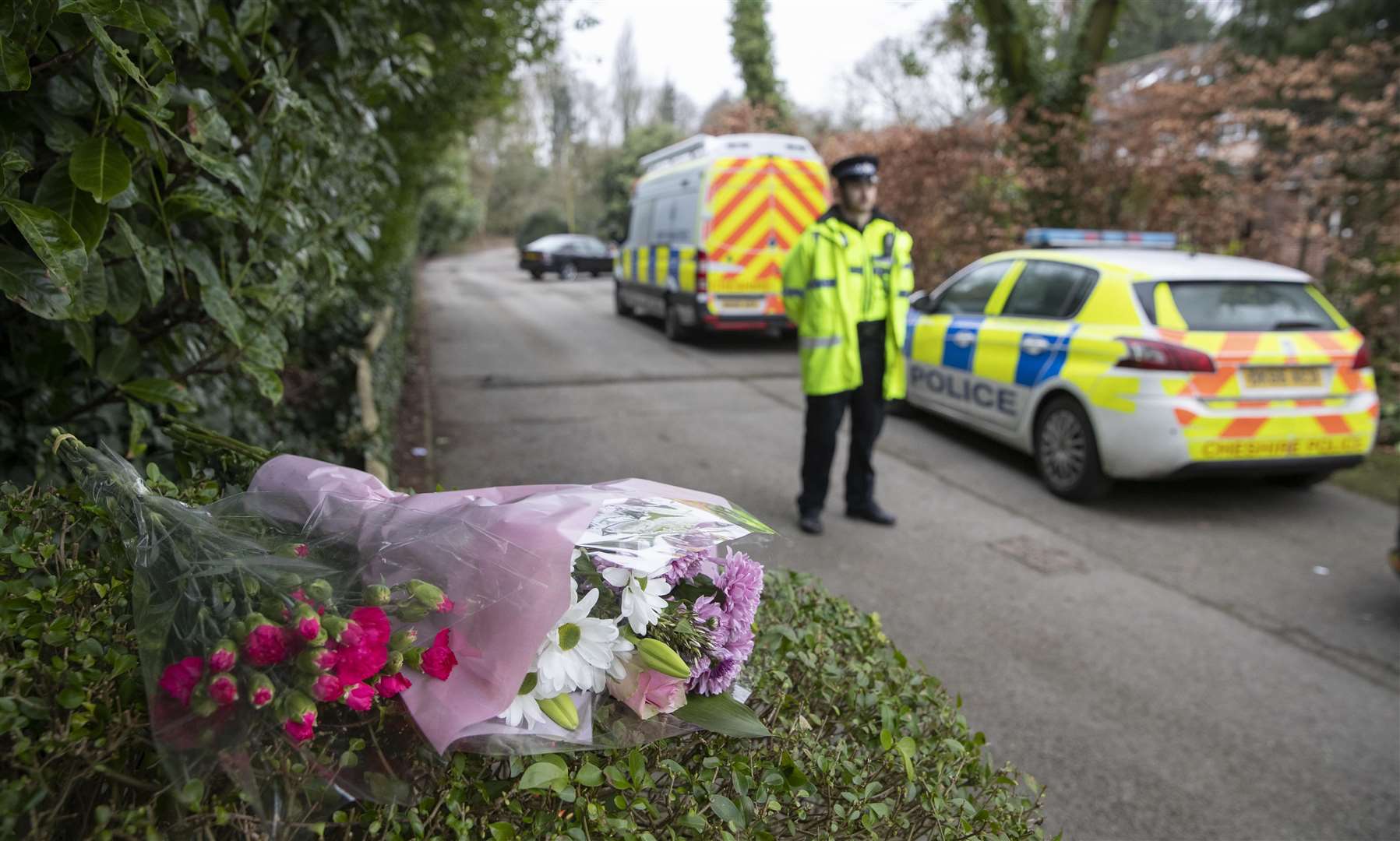 Floral tributes left at the scene (Jason Roberts/PA)
