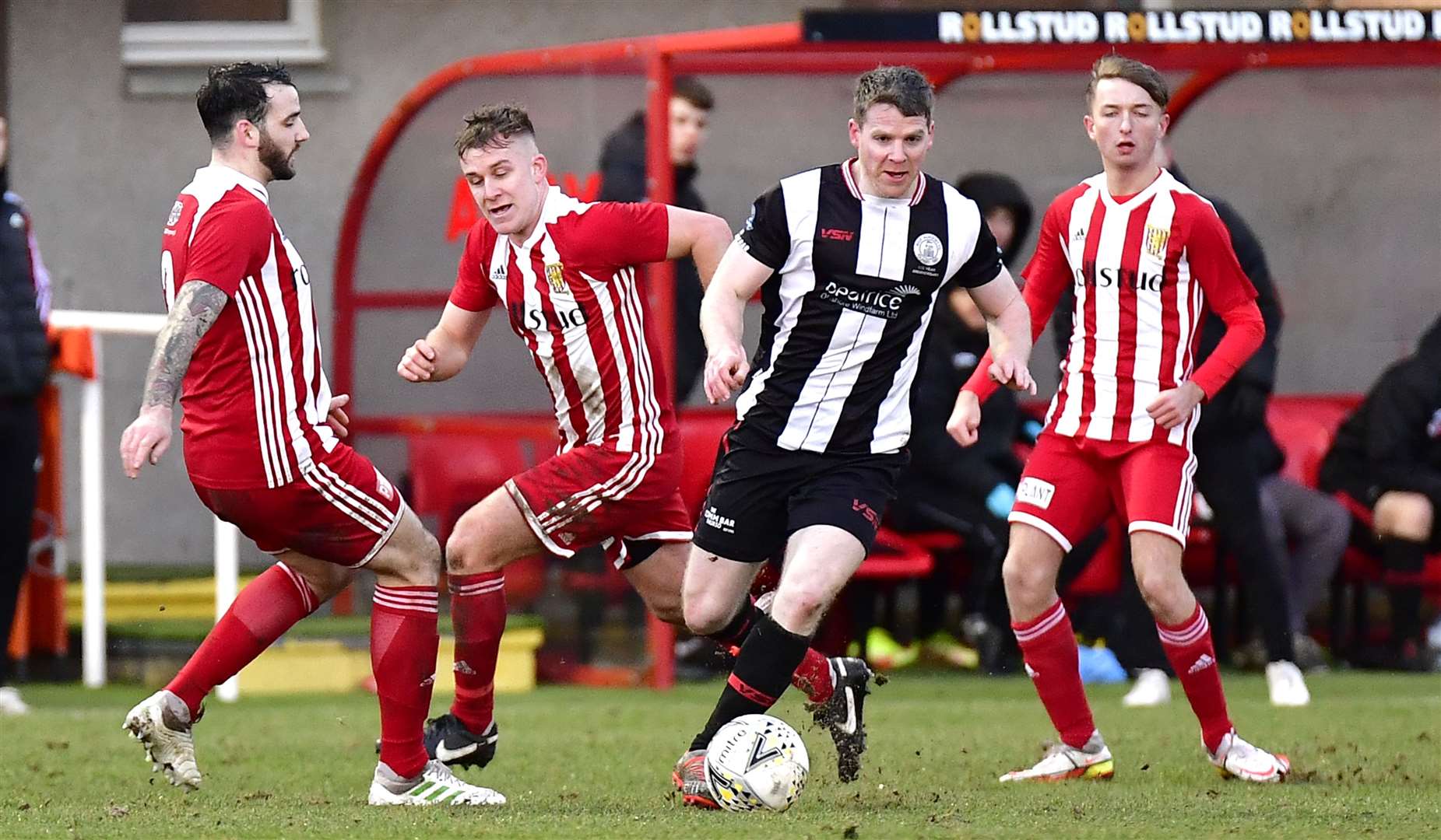 Wick Academy's Davie Allan weaves his way through a clutch of Formartine players at North Lodge Park. Picture: Mel Roger