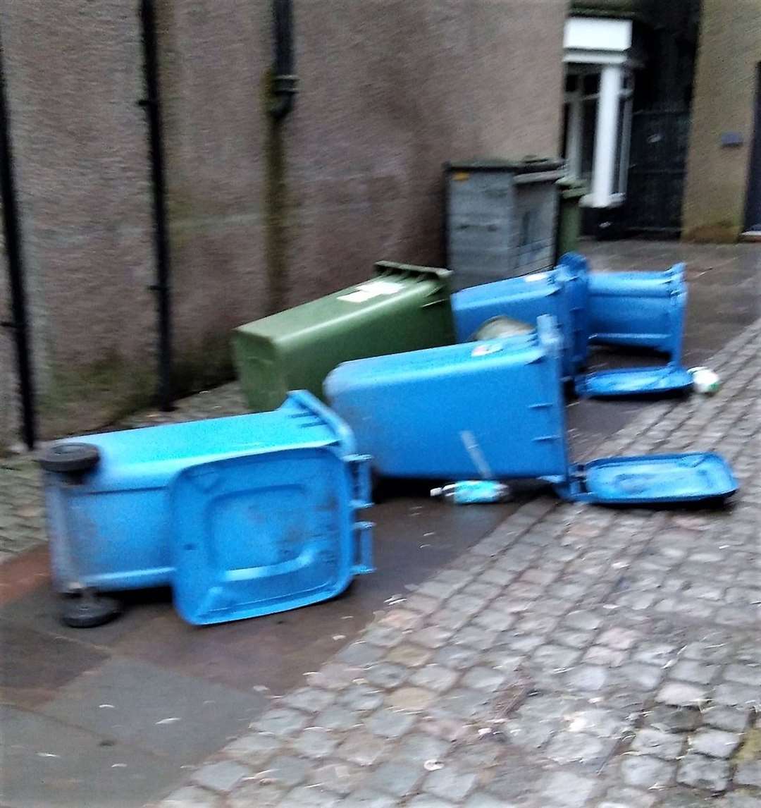 Recycle bins knocked over in Wick town centre after the Hogmanay revelling. Picture: Derek Bremner