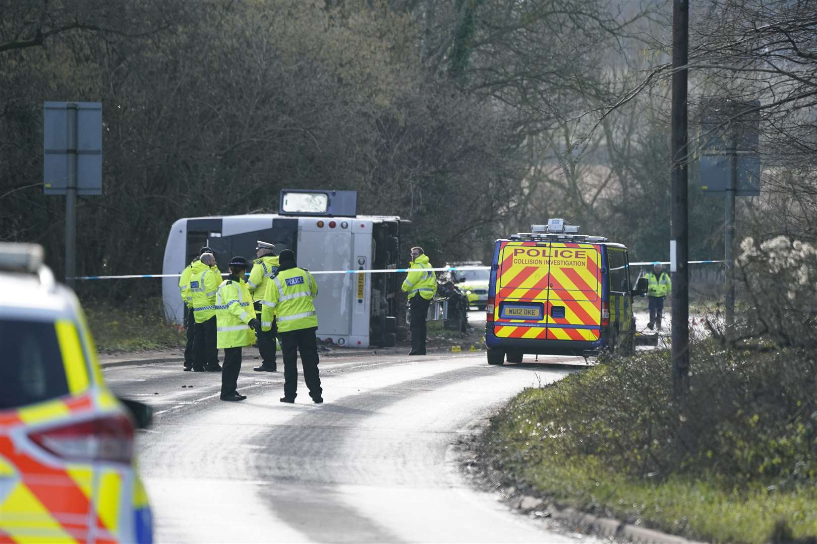 Police at the scene on the A39 in Bridgwater after a double-decker bus overturned (Andrew Matthews/PA)