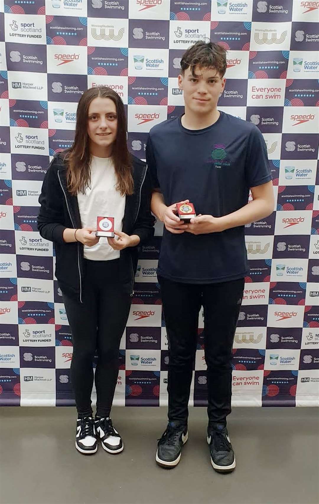 Emily MacDougall and Tom Armitage with their medals.
