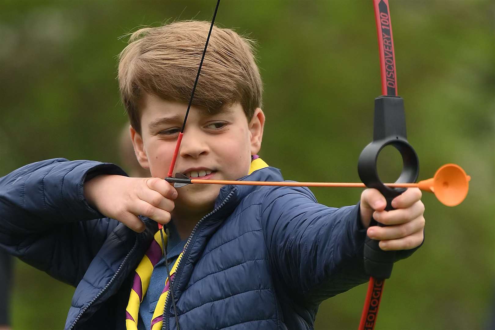 Prince George tries archery with the volunteers (Daniel Leal/PA)