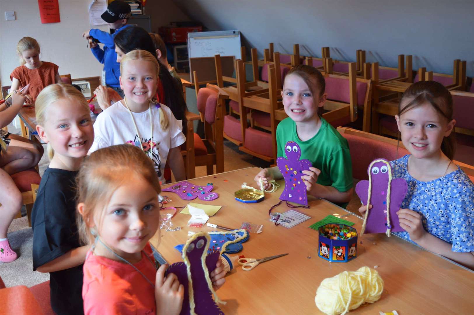 A group of girls enjoying a craft session.