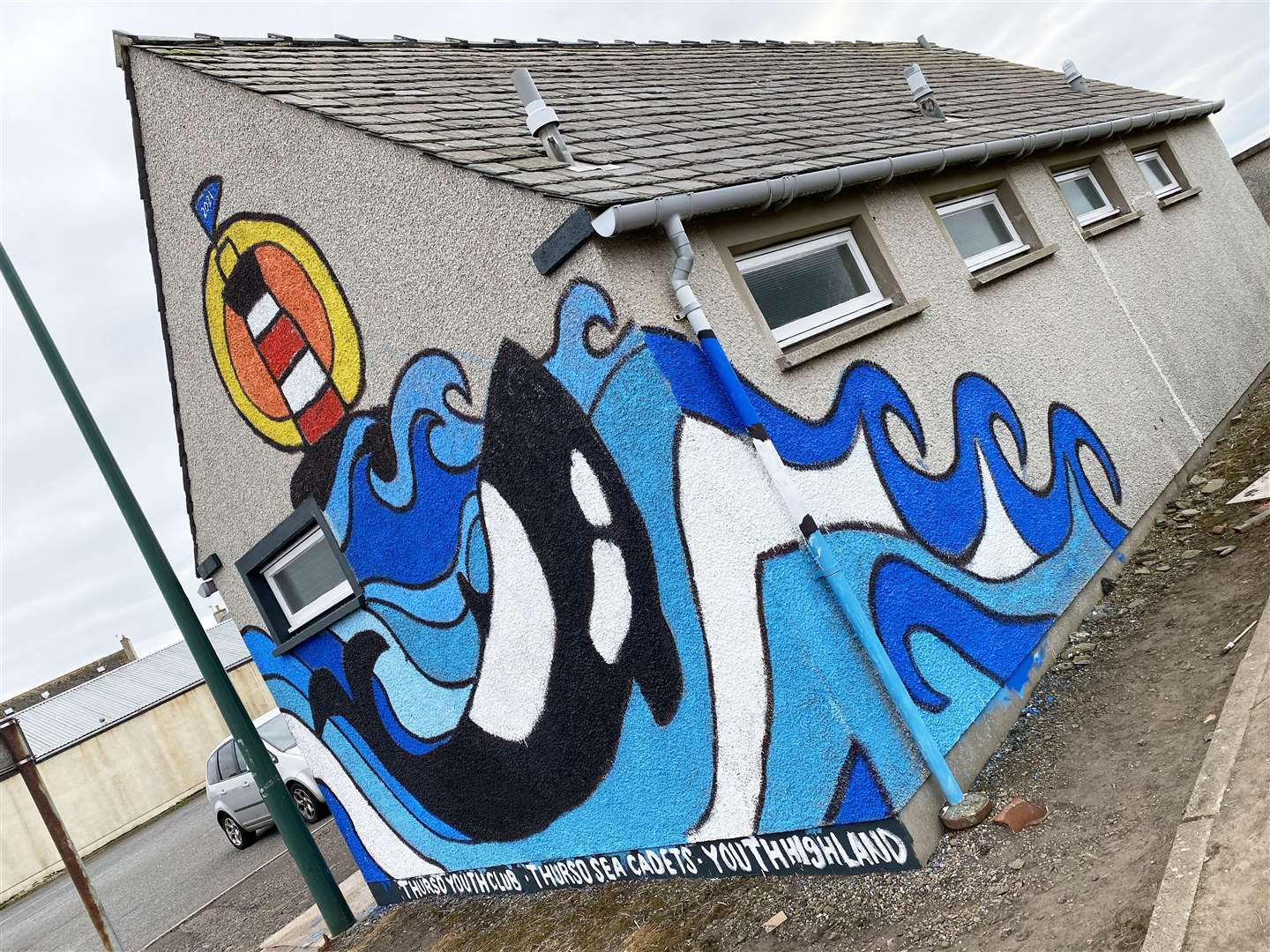 The completed mural with an orca as its centrepiece. It was created by Thurso sea cadets and members of Thurso Youth Club, supported by Youth Highland.