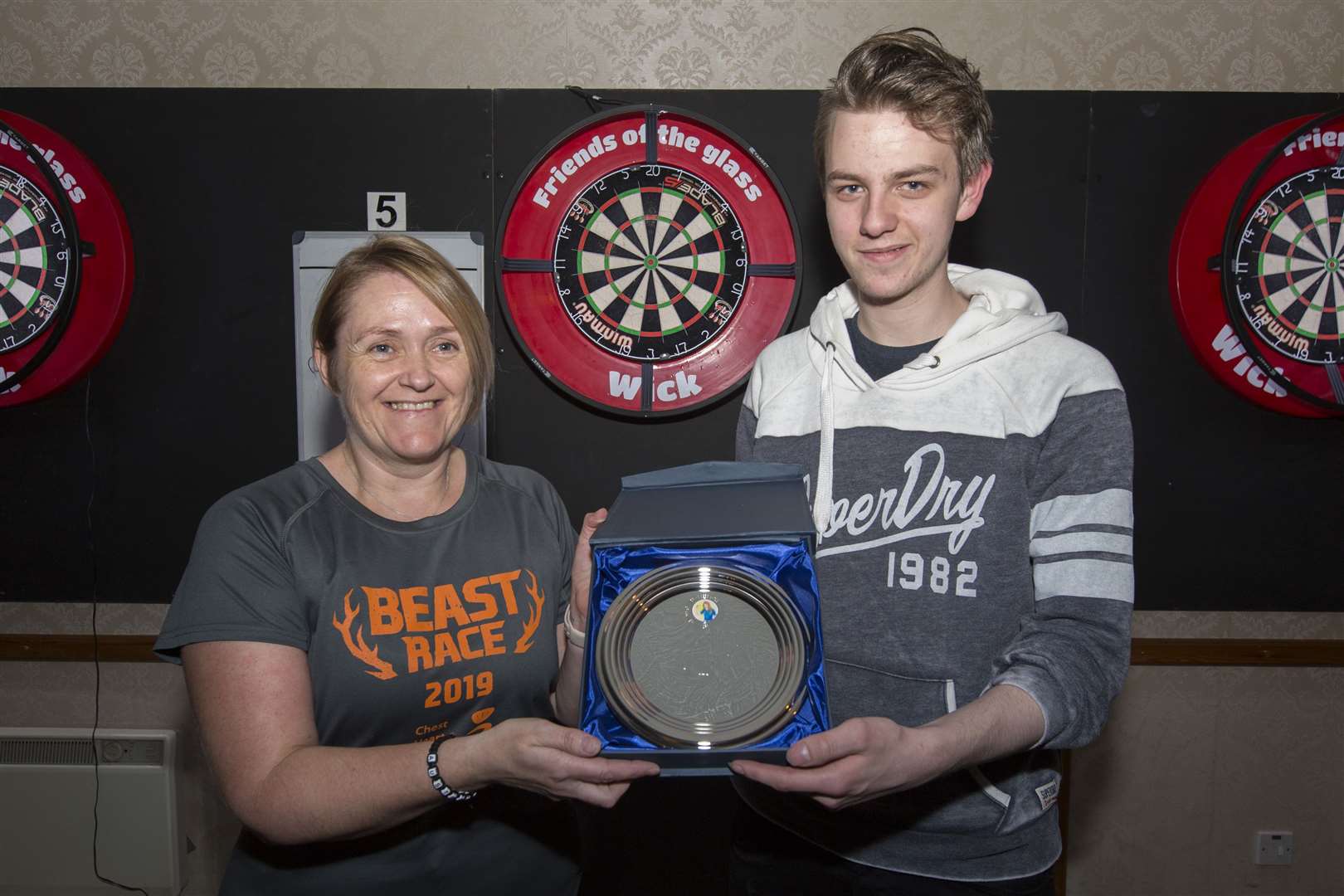Cath Begg, one of the stalwarts of the ladies' darts scene in Caithness, is retiring from the game and has received a lifetime award from the Wick and District Darts League. Cath, from Keiss, began playing for her village pub team around 26 years ago, moving on about 15 years later to the Smiddy Inn for a few seasons and then to the Crown Bar team which she has represented until her newly announced retiral. The presentation was made by Scott Crowden. Picture: Robert MacDonald / Northern Studios