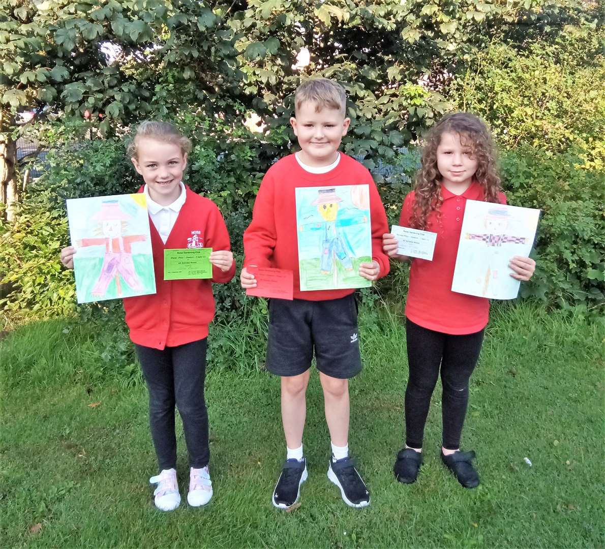 From left, Abbie Duncan, Kyle Chalmers and Amber Macphee with their winning artworks.