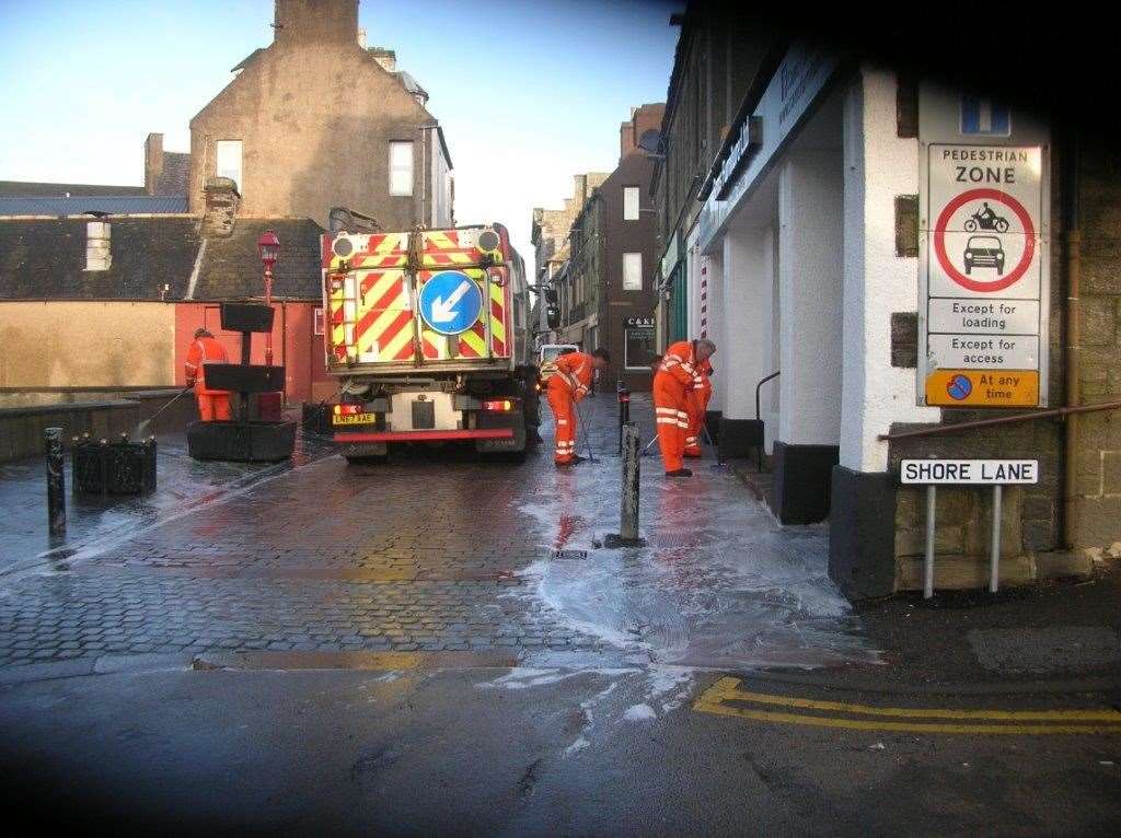 Highland Council staff beginning the 'deep clean' in Wick's town centre.