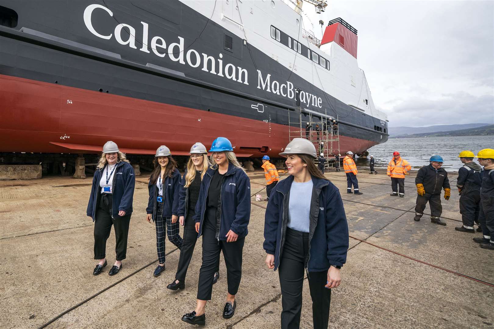 Apprentice shipbuilders including Beth Atkinson (blue hat) who launched the ferry (Jane Barlow/PA)